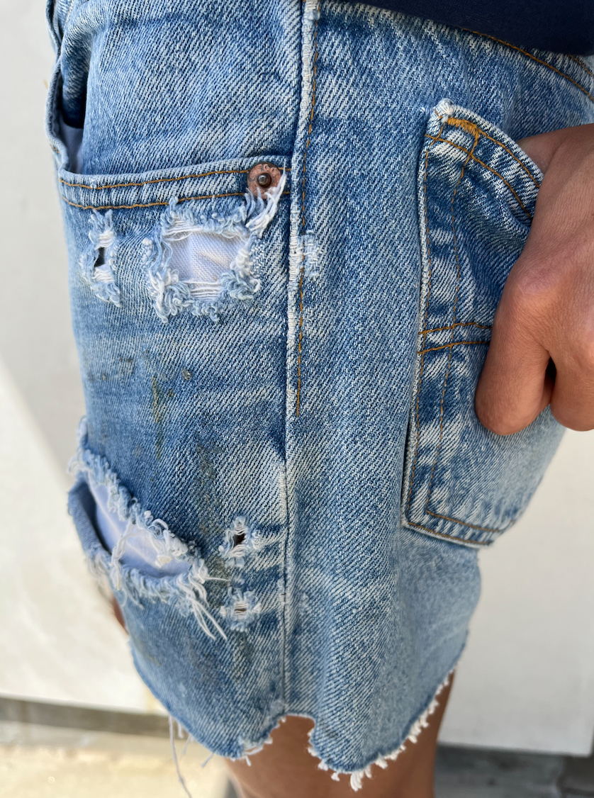 Vintage distressed levi shorts deals
